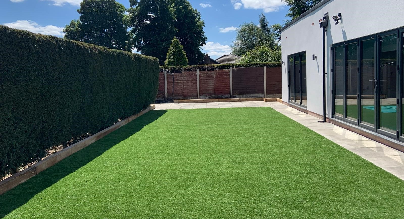 Artificial grass and landscaped garden