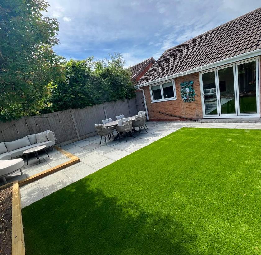 Artificial lawn installed alongside a porcelain patio