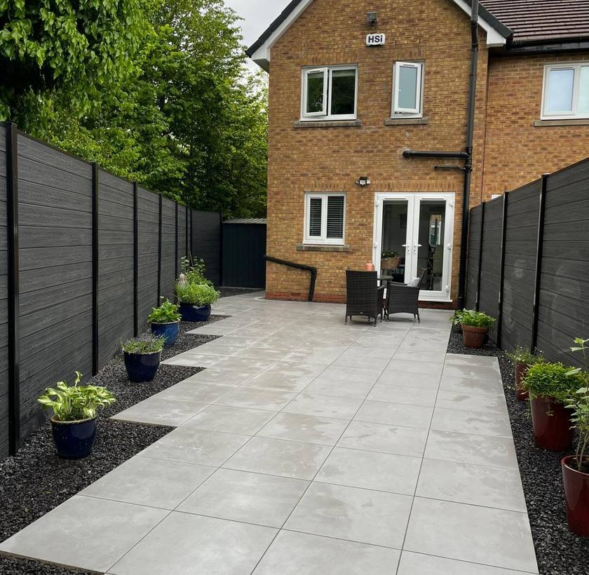 Porcelain patio and composite fencing installed by Everlasting Lawns